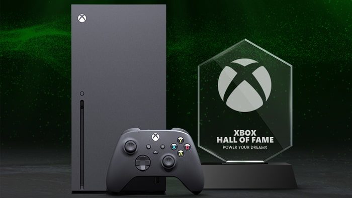 Console Xbox Series X, controller e un trofeo con la frase: 