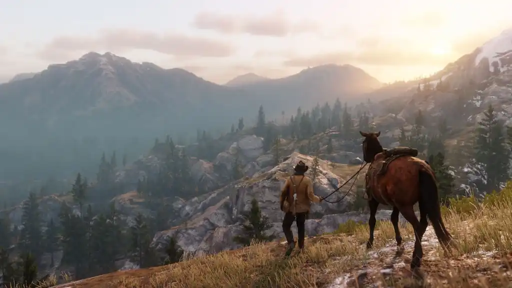 Arthur osserva la scogliera di una montagna in Red Dead Redemption 2