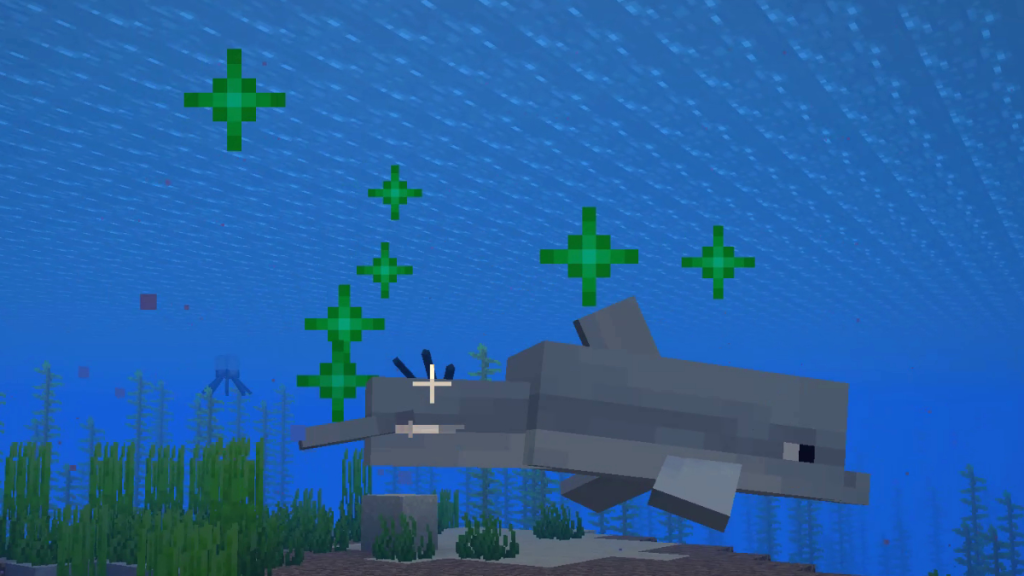 Effetti delle particelle verdi dopo aver dato da mangiare a un delfino in Minecraft