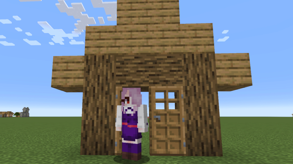 In piedi nella cornice di una casa di quercia in Minecraft