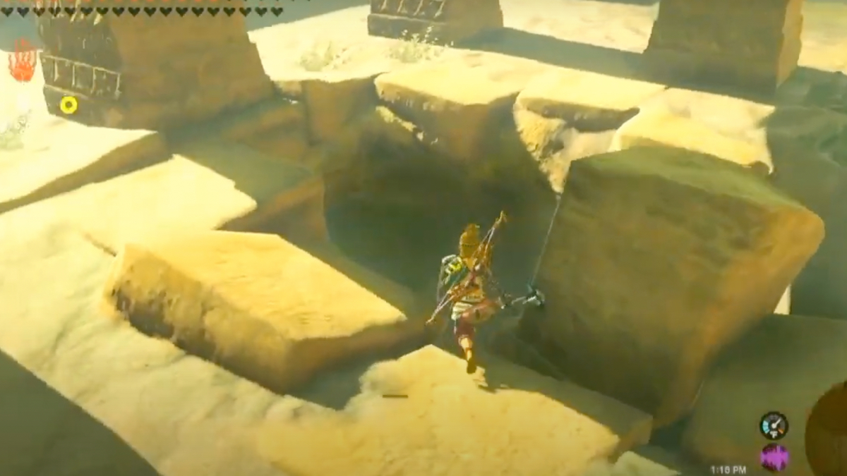 Link va alla carica verso un buco molto grande nella pietra di un'antica rovina.
